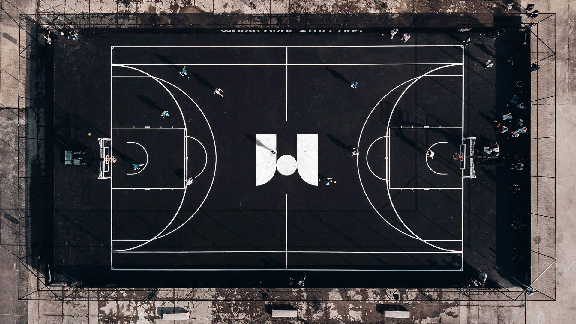 Aerial view of a basketball court with the WFA logo in the center