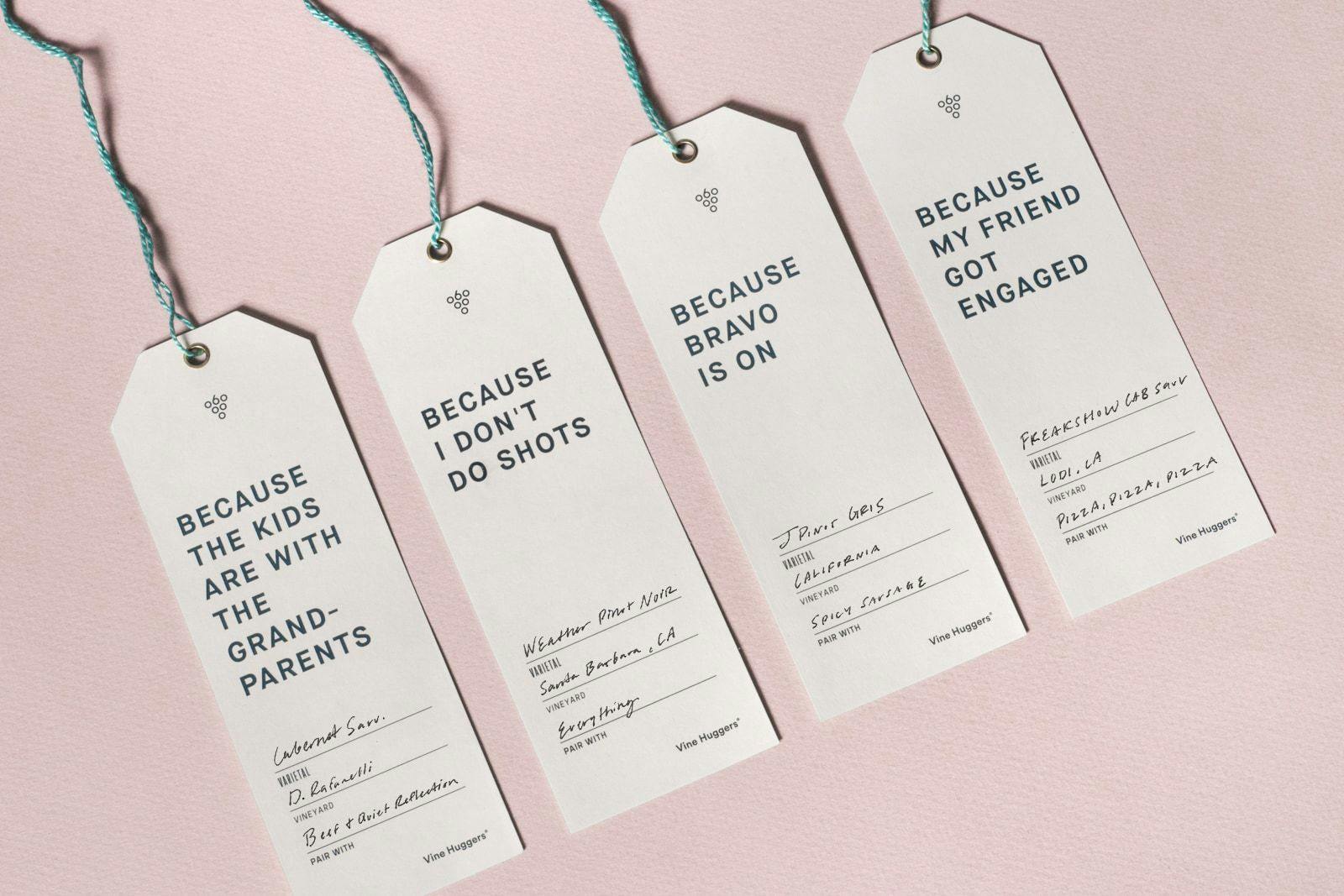 Four wine bottle tags with various messages on them