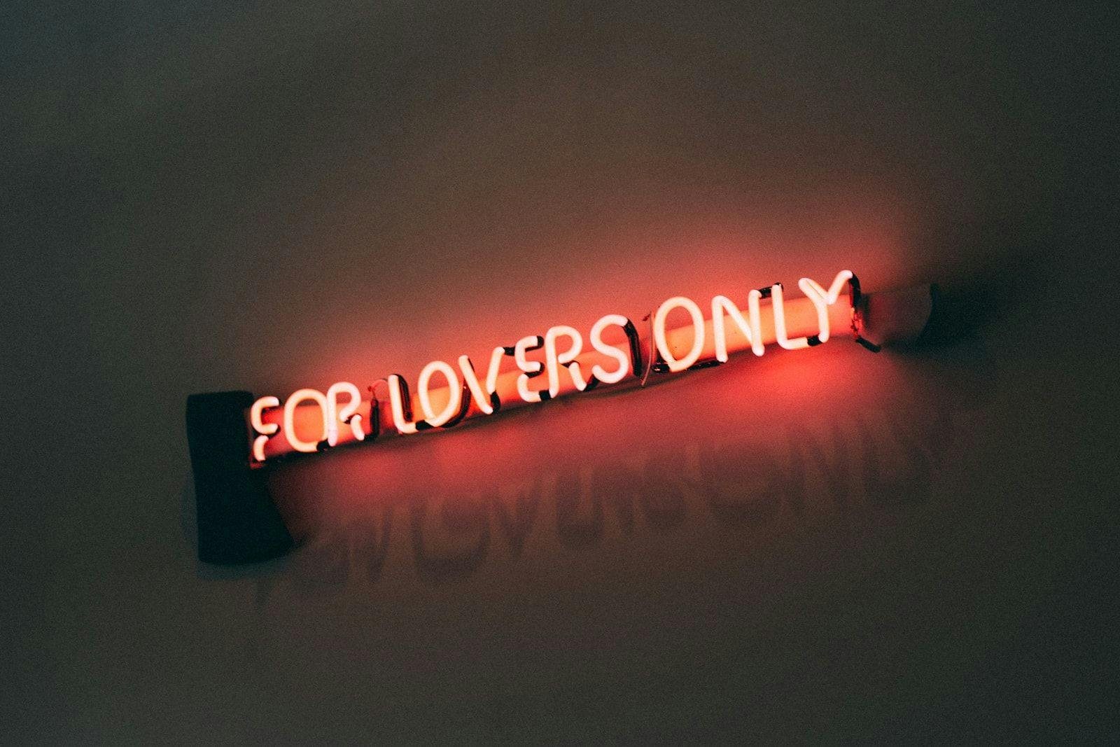 A neon sign that says for lovers only 
