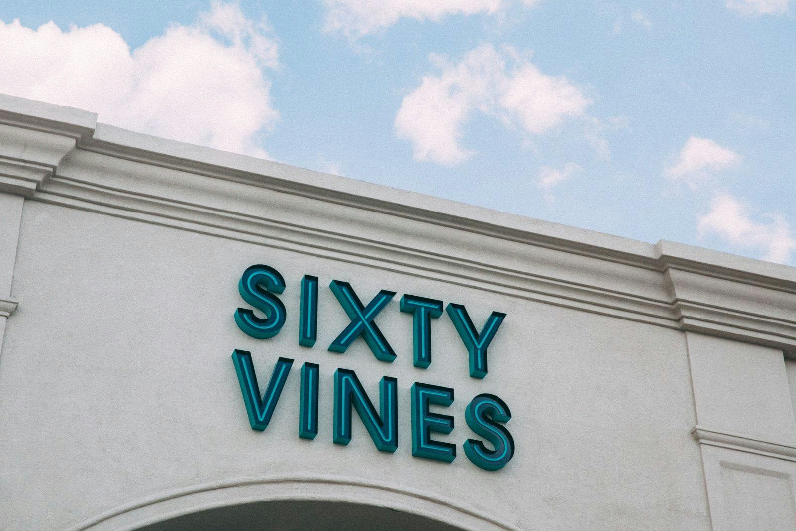 Signage for Sixty Vines on the exterior of the restaurant